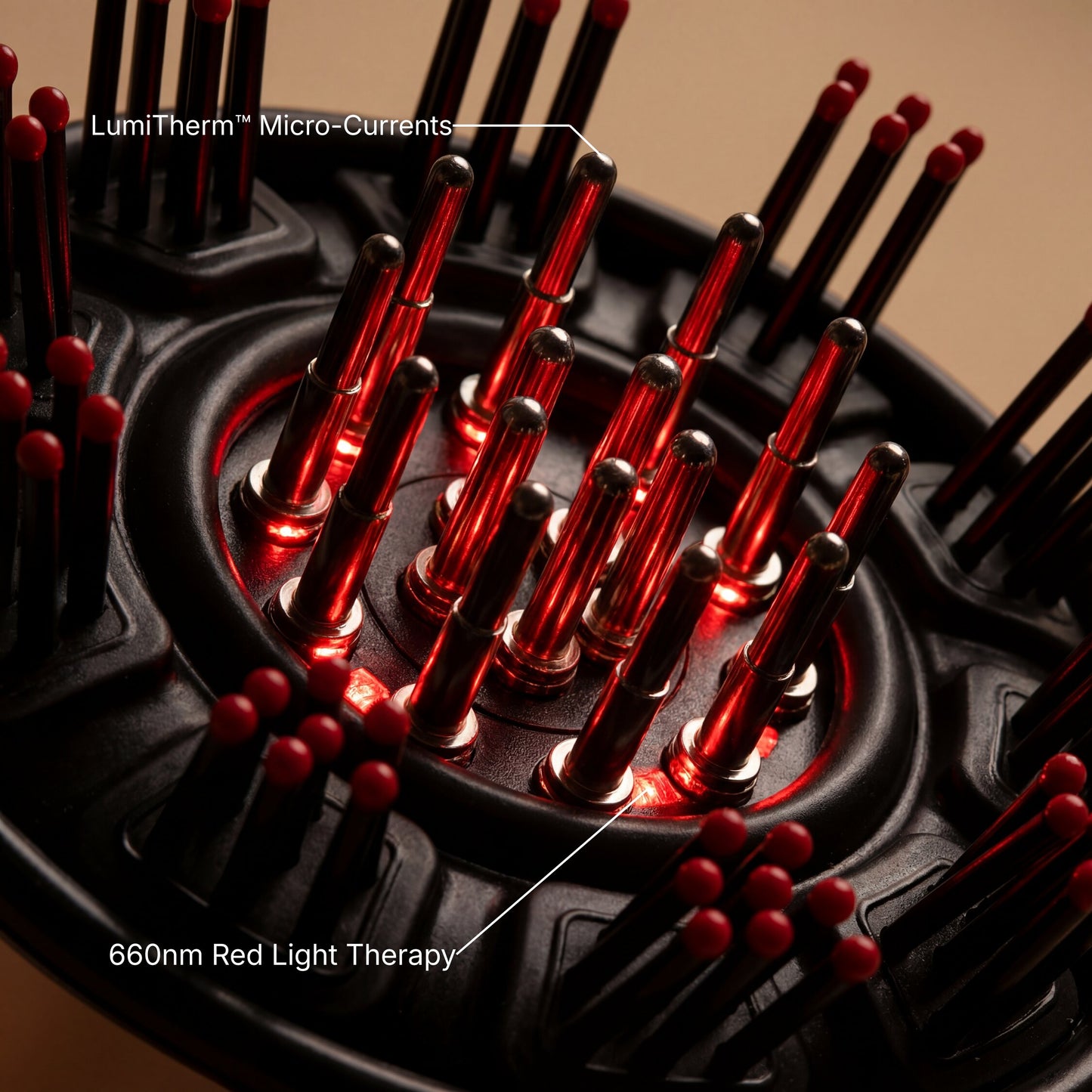 Close-up of a black circular scalp massager with multiple red-tipped micro-current needles and glowing red light therapy elements, with text labels reading 'LumiTherm Micro-Currents' and '660nm Red Light Therapy'.