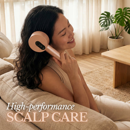 Woman using a luxera device in a cozy living room.