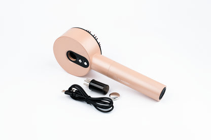 LUXÉRA premium scalp massager shown with included USB charging cable.