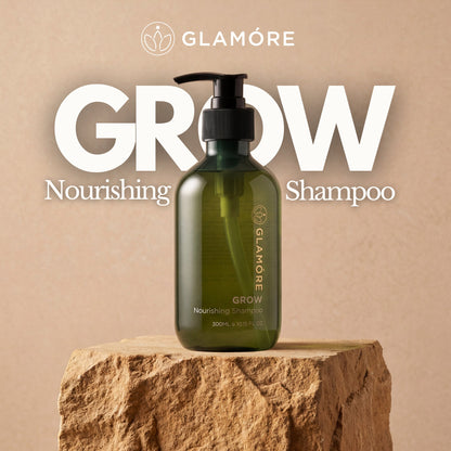 Glamore Grow Nourishing Shampoo bottle on a stone platform with a beige background