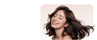 Woman with long brown hair on a beige background